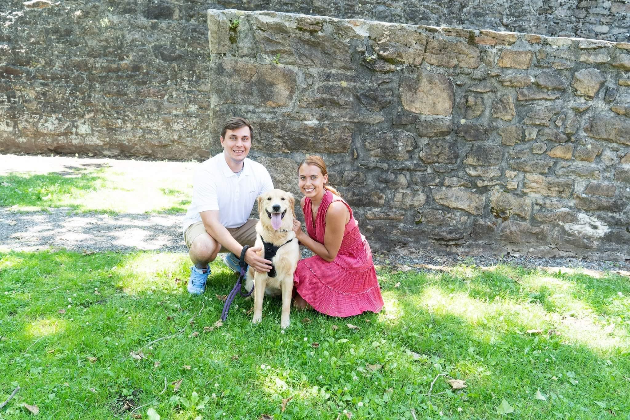 Austin and Alivia with their dog - your trusted pet care team